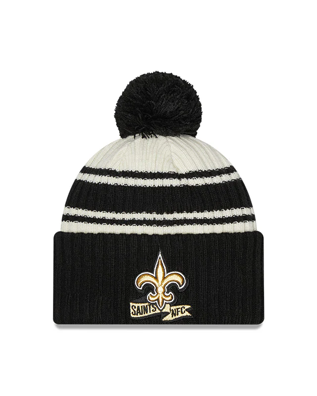 New Orleans Saints New Era 2022 Sideline - Sport Cuffed Pom Knit Hat - Cream/Black